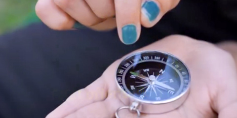 Close-up of a pocket watch in a person's hands